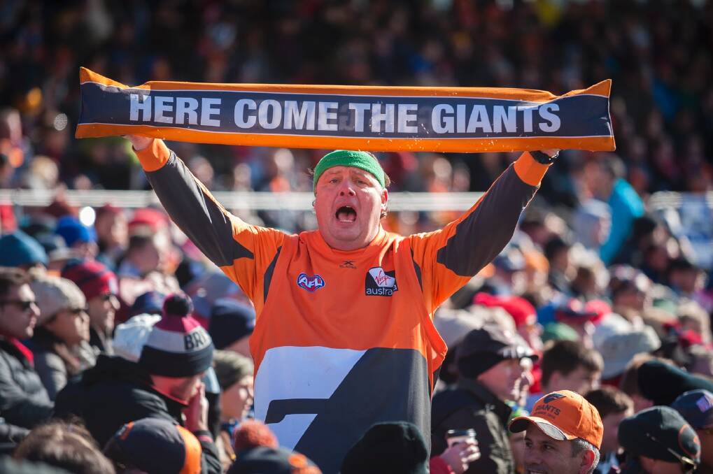 A Giants fan shows his passion at Manuka Oval. Photo: Dion Georgopoulos