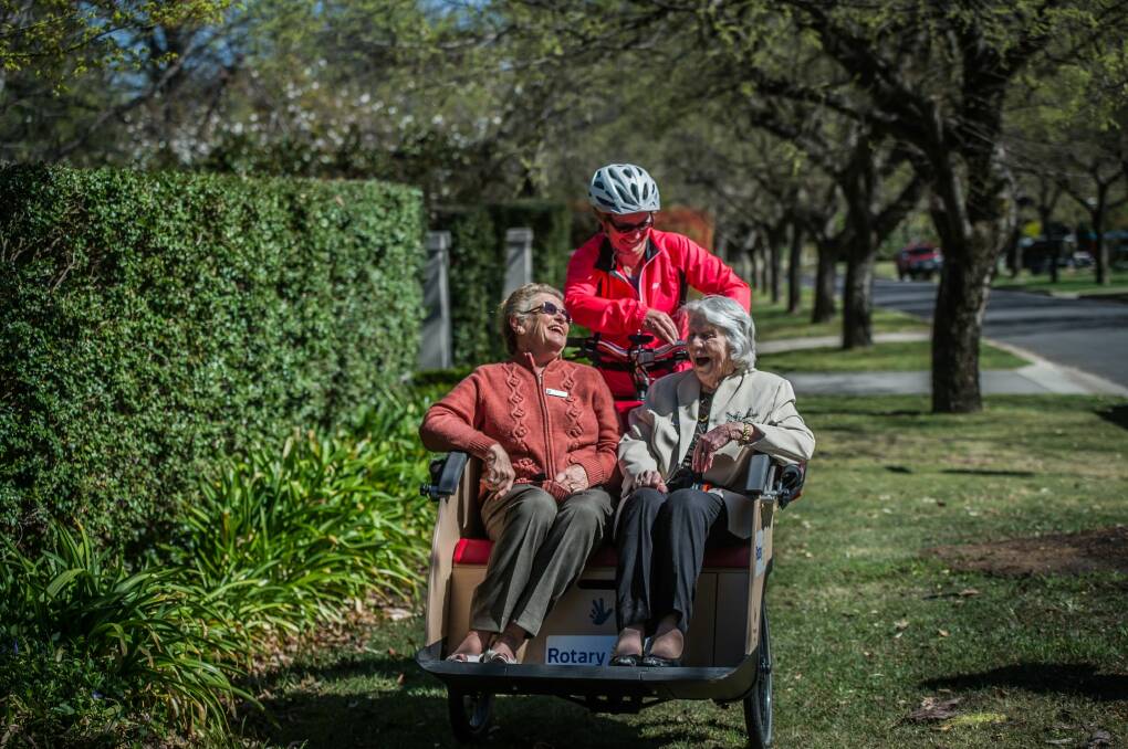 Adrienne Capp, 80 and Beryl Hunter, 99, piloted by Caroline Fargher of Pedal Power.  Photo: Karleen Minney