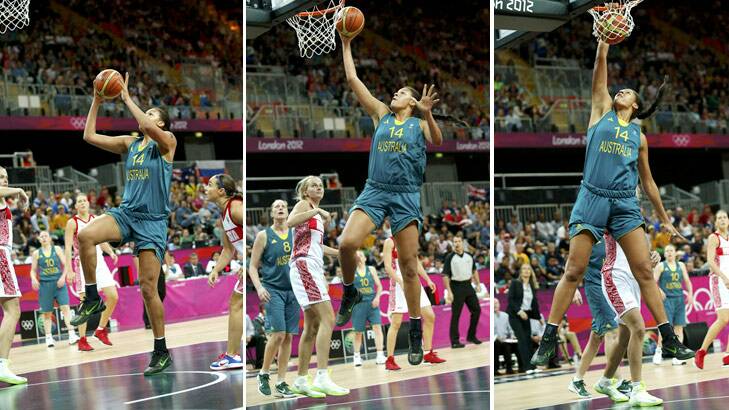 One, two, three ... Liz Cambage unleashes a slam dunk against Russia. Photo: Reuters