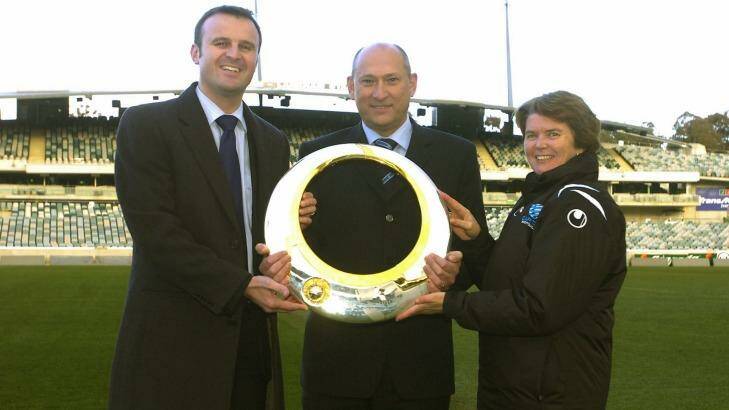 Andrew Barr, Ivan Slavich and Heather Reid with the A-League trophy in 2007. Reid says it will realistically cost upwards of $8 million a season to run an A-League team. Photo: Martin Jones