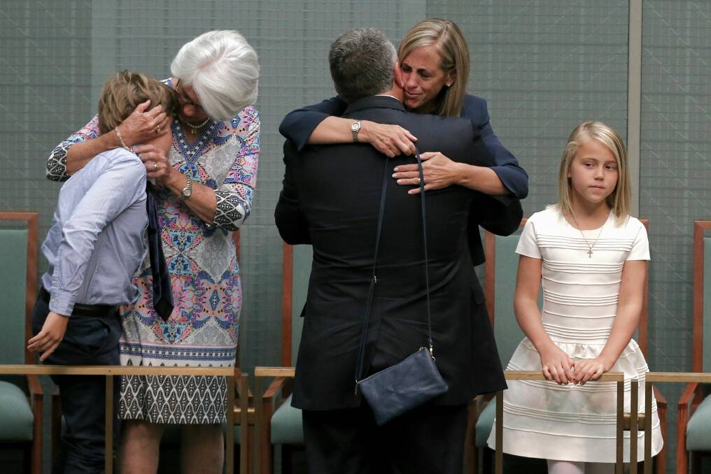 Joe Hockey embraces by his wife Melissa Babbage after his final speech to Parliament in October.