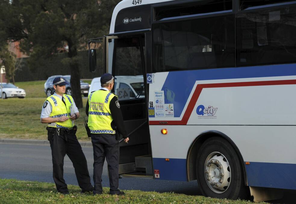 Fatal accident: The bus that hit Carolle Harrison on Canberra Avenue was carrying school children. Photo: Graham Tidy