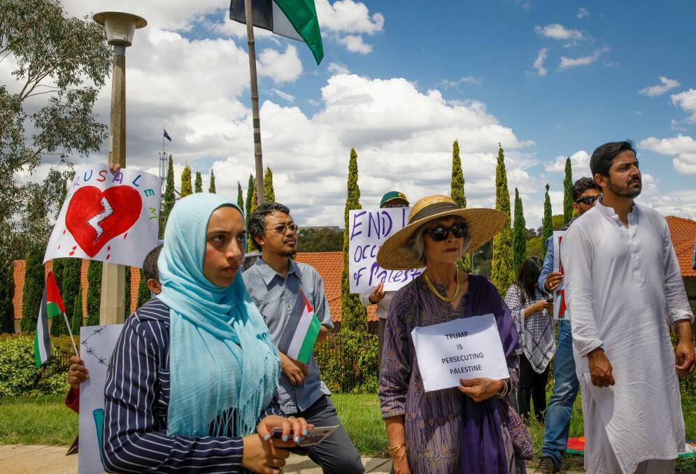 Community members from mixed faiths rally in front of the US embassy in Canberra to protest US President Donald Trump's decision to move the US embassy from Tel Aviv to Jerusalem. Photo: Sitthixay Ditthavong Photo: Sitthixay Ditthavong