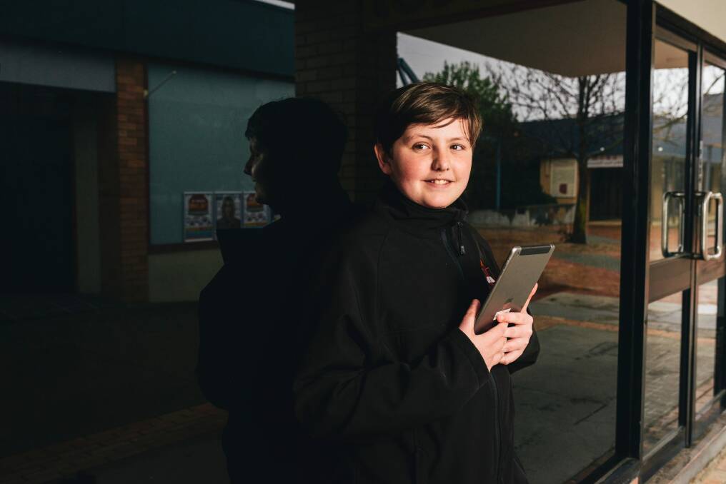 Belconnen High year 7 student Reece Bowman with a tablet. Chief Minister Andrew Barr insisted the policy was not a vote buyer.  Photo: Rohan Thomson