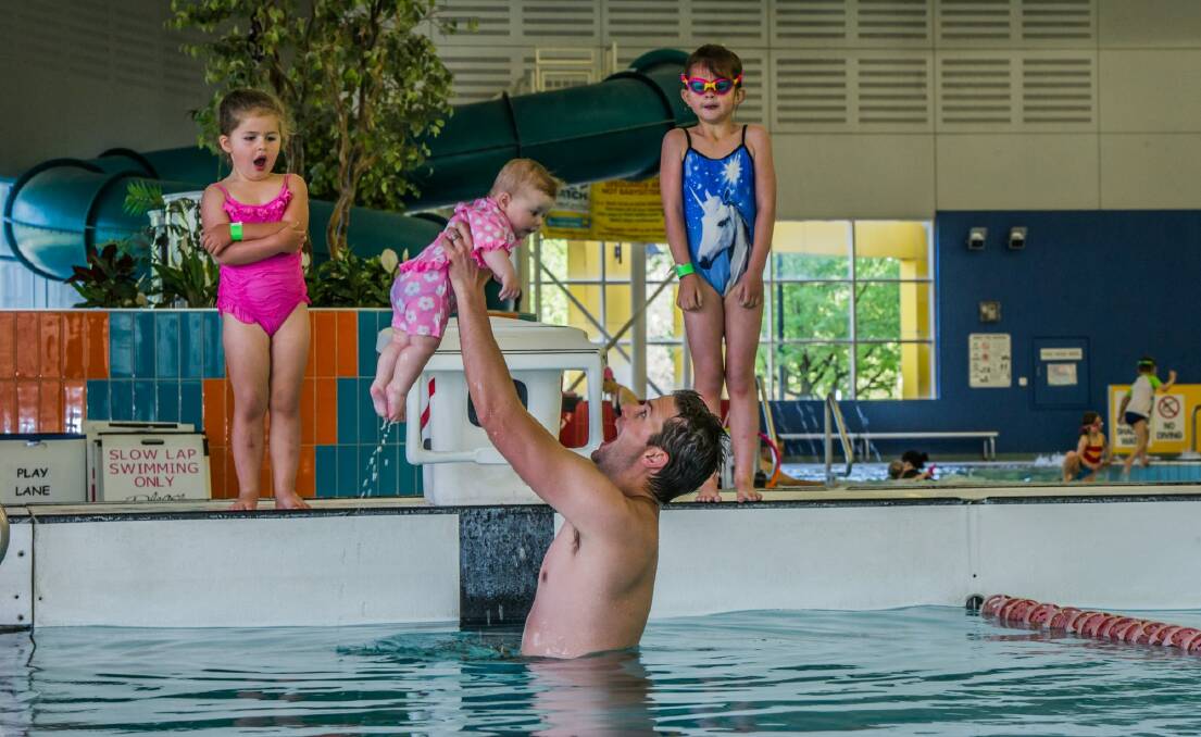 Canberra police officer Paul Reynolds (pictured with daughters Ruby, 5, Poppy, 3, and May, 6 months) is a recipient of the Churchill Fellowship for his work in trying to reduce incidents of drowning, particularly among young children.  Photo: Karleen Minney
