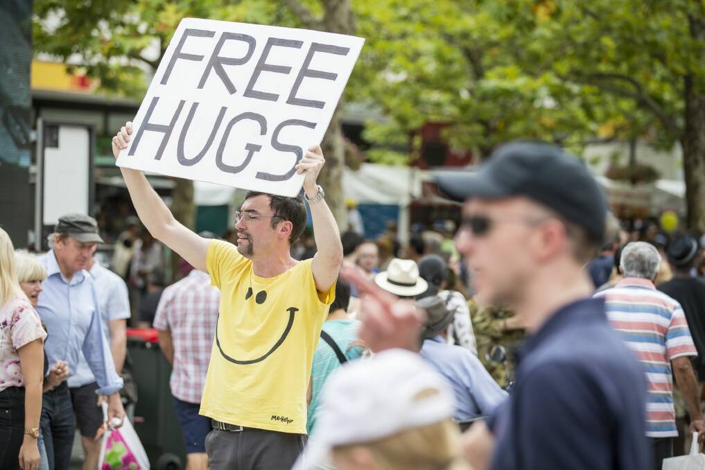 A man offers free hugs at the festival. Photo: Matt Bedford