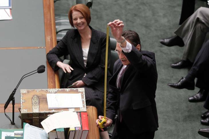 Trade Minister Craig Emerson displays a tape measure during question time as Prime Minister Julia Gillard looks on. Photo: Andrew Meares
