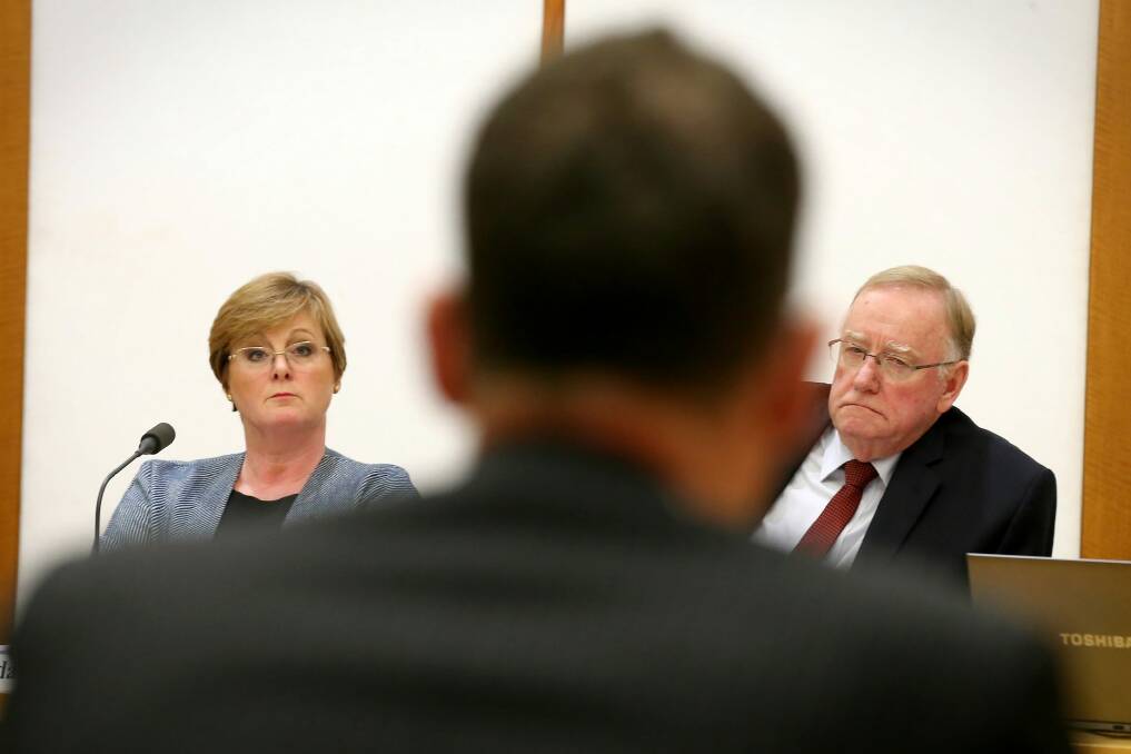 Senators Linda Reynolds and Ian Macdonald question outgoing Solicitor-General Justin Gleeson.  Photo: Alex Ellinghausen