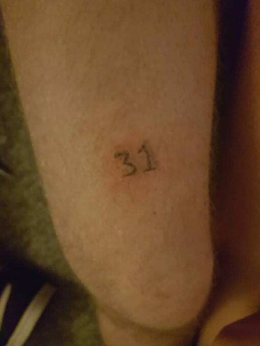 He asked for a 13 but they drew a ... 
The Queanbeyan man with this tattoo wasn't sure at first, but now he loves it. Photo: Supplied