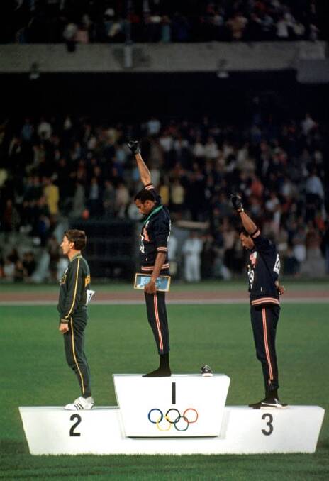 Peter Norman, Tommie Smith  and John Carlos. Smith and Carlos give a Black Power salute on the medal podium at the 1968 Mexico Olympics.