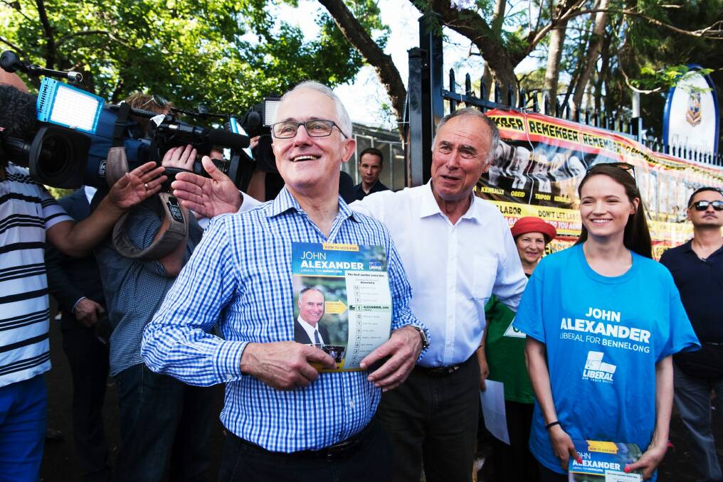 Prime Minister Malcolm Turnbull with Liberal candidate John Alexander at Gladesville Public School. Photo: James Brickwood
