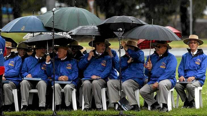 Rain fell on the choir as Prime Minister Paul Keating addressed the Remembrance Day commemoration at the Australian War Memorial. Photo: Andrew Meares
