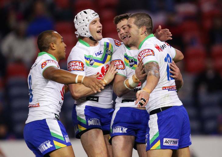 The Raiders celebrate Joel Thompson's try against the Knights. A week-long bonding camp in the lead-up to the match proved crucial to the win. Photo: Getty Images