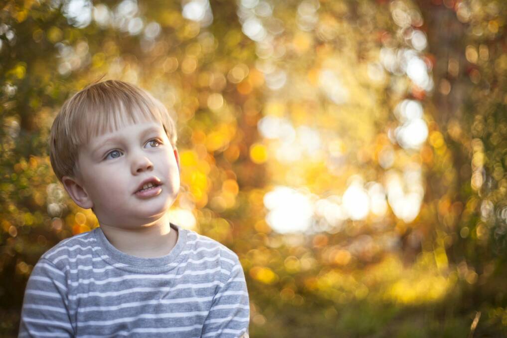 Jenny Dettrick captured the "glowing" autumn sunlight in a photo of her four-year-old son Ben Ubrihien playing in the family's backyard in Macgregor. Photo: Jenny Dettrick