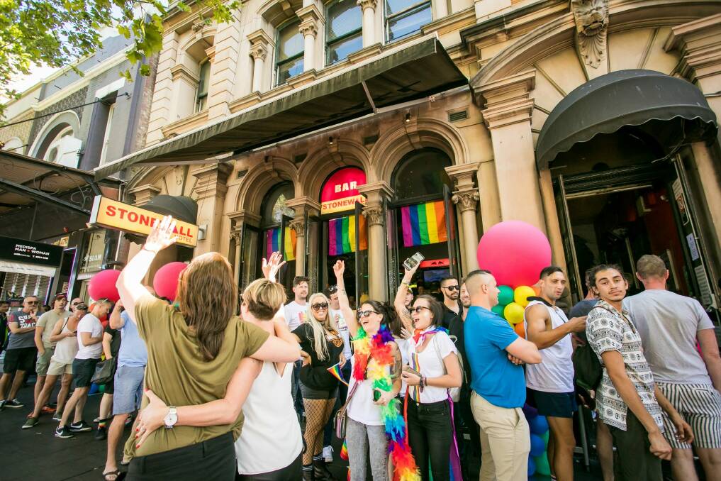 Supporters of same-sex marriage celebrate the "yes" verdict at the iconic Stonewall Hotel on Sydney's Oxford Street. Photo: Anna Kucera