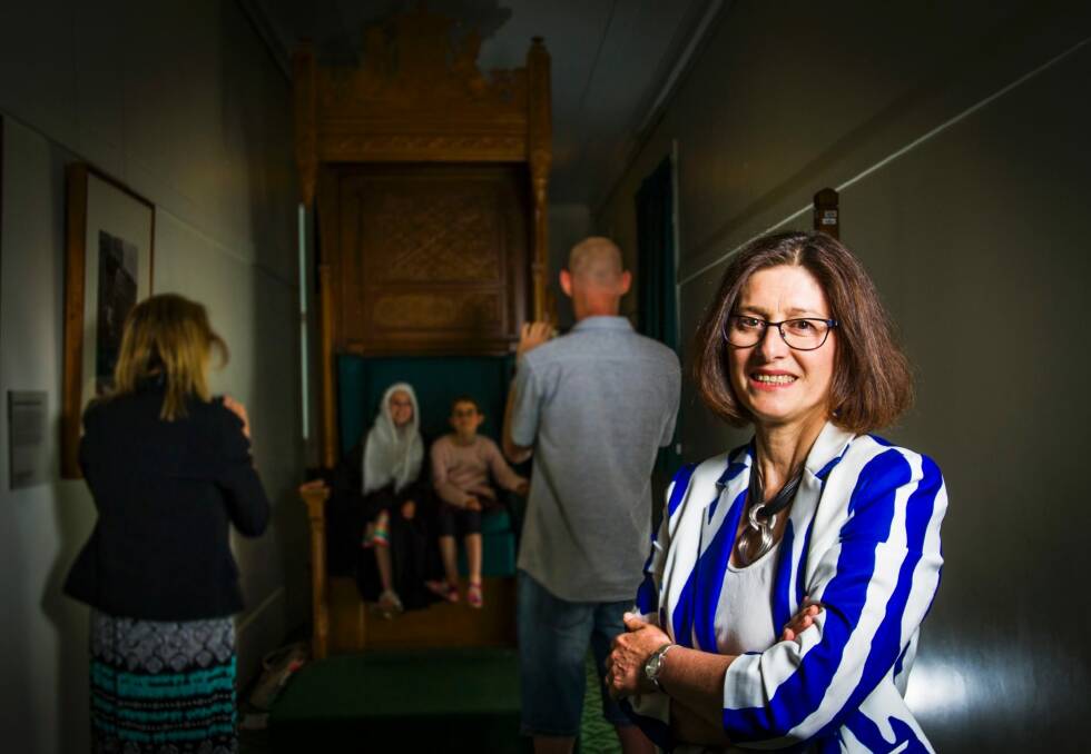 Museum of Australian Democracy's director Daryl Karp with the visiting James family of Melbourne. Photo: Elesa Kurtz