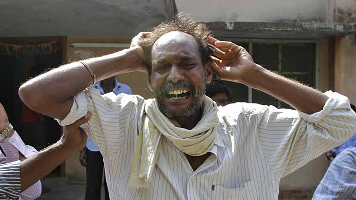 Distraught ... a man mourns the death of a relative killed in one of Thursday's explosions in Hyderabad. Photo: Reuters