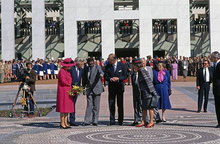 Queen Elizabeth II, Prime Minister Bob Hawke, artist Michael Nelson Jagamara and the Duke of Edinburgh at the official opening of new Parliament House, Canberra, 1988.  Photo: National Archives of Australia