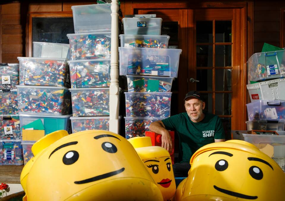 Charlie Bigg-Wither surrounded by tubs of Lego he is selling via the Green Shed for Canberra Hospital Foundation.  Photo: Sitthixay Ditthavong