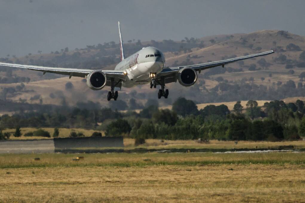 A Qatar Airways plane landing at Canberra airport. Photo: karleen minney
