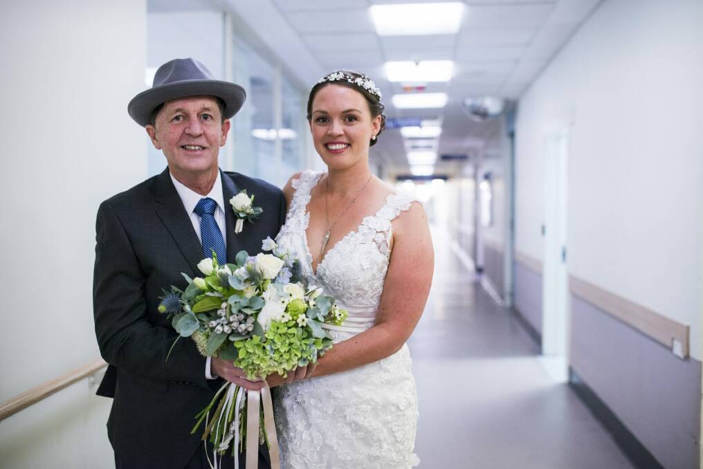 Malcolm Gibson with his daughter Kate before her wedding at the Canberra Hospital. Photo: Rohan Thomson
