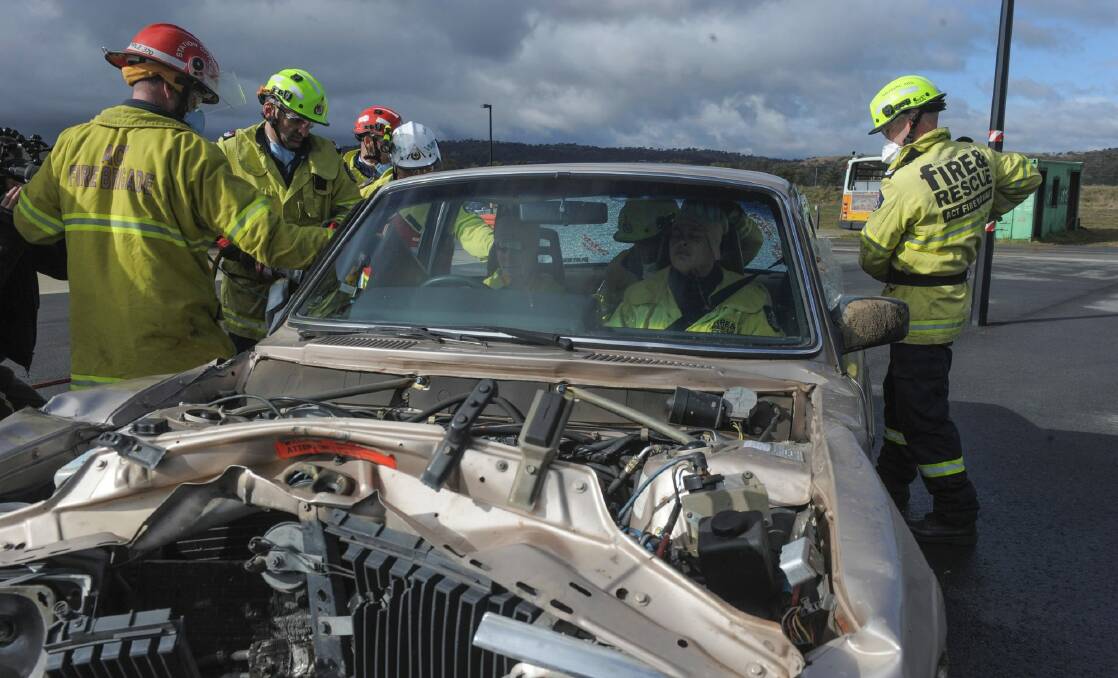 ACT firefighters during a training exercise. They attended 1182 road accident rescue operations in the ACT last financial year. Photo: Graham Tidy