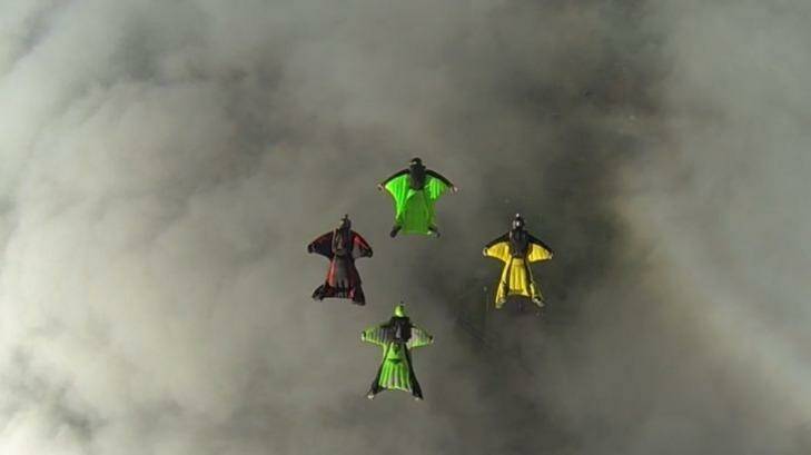 Wingsuit pilots in action above Goulburn. Photo: Ashleigh Darby