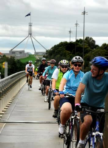 Cyclists ride ride across the Kings Avenue Bridge ... The new "hierarchy of transport" planned for the parliamentary triangle will place cyclists and pedestrians above motorists. Photo: Marina Neil