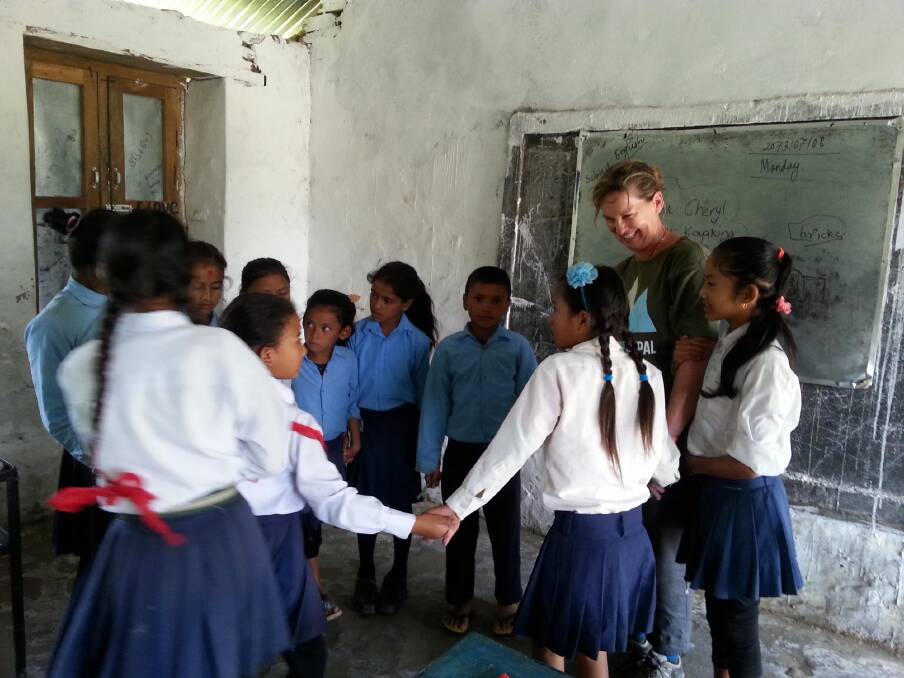 Supporters of Canberra charity REACH for Nepal also spend time with local children, including in the classroom. Photo: Supplied
