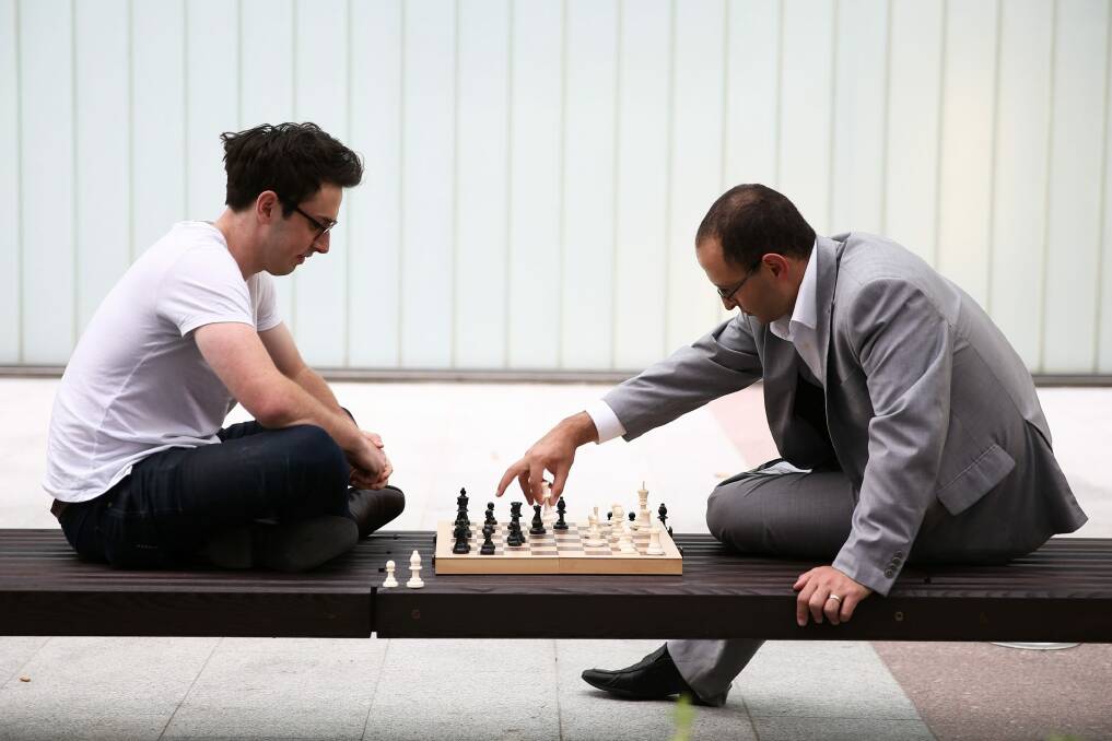 Michael Pettersson plays chess with former economics advisor to Arthur Sinodinos John Adams in 2015.  Photo: Alex Ellinghausen