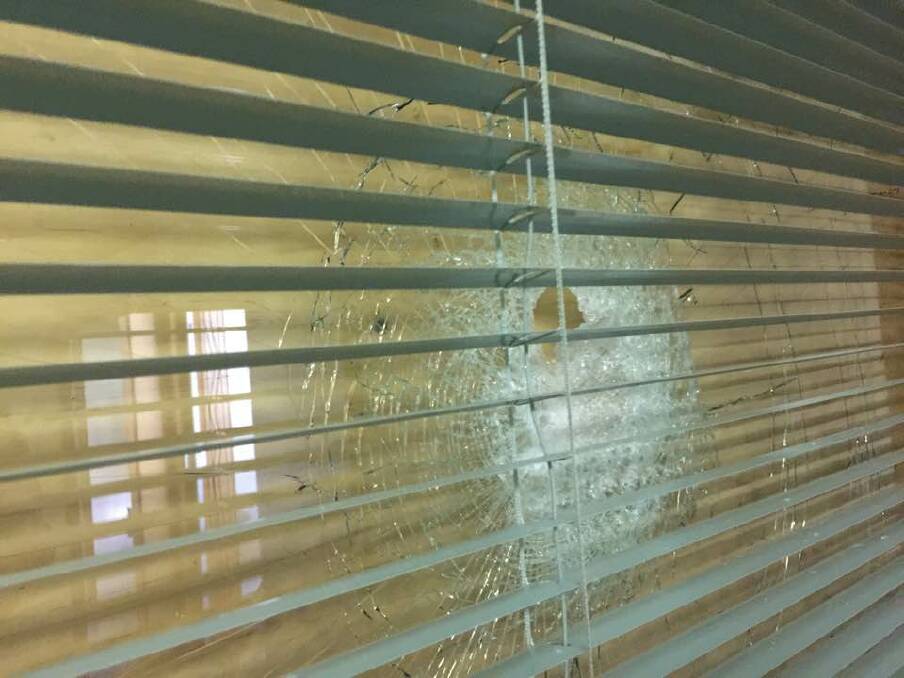 A smashed window at a Canberra synagogue. Photo: Executive Council of Australian Jewry