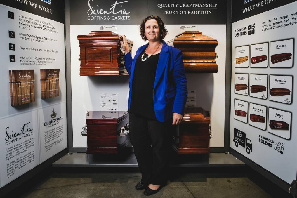 Melanie Greenhalgh with the coffins for sale at Costco. Her choice is 'The Richmond'. Photo: Jamila Toderas