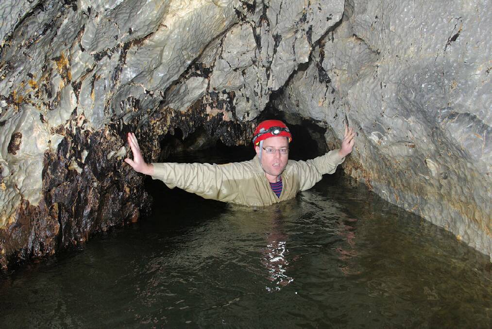 Tim explores the river cave. Photo: John Brush