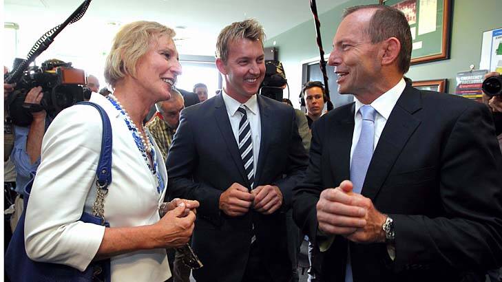 Lieutenant Colonel Cate McGregor, pictured with former cricketer Brett Lee and Prime Minister Tony Abbott, during the launch of the Prime Minister's XI late last year. Photo: Alex Ellinghausen
