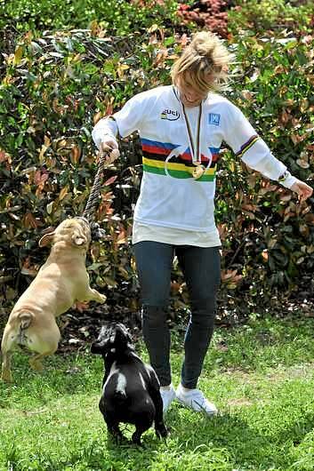 World champion BMX rider, Caroline Buchanan, at her Kambah home with her pet french bulldogs, Diesel and Brie. Photo: Graham Tidy