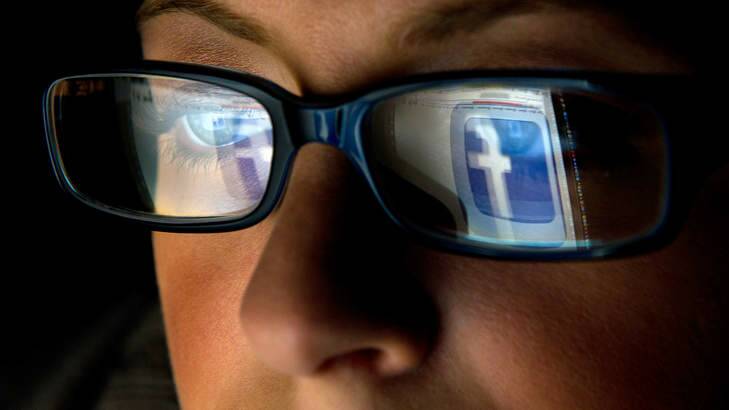FILE: In this file photo the Facebook Inc. logo is reflected in the eyeglasses of a user in this arranged photo in San Francisco, California, U.S., on Wednesday, Dec. 7, 2011. A Facebook IPO would provide funds to help the social-networking service maintain its expansion and fend off competition from Internet rivals such as Google Inc. and Twitter Inc. Photographer: David Paul Morris/Bloomberg