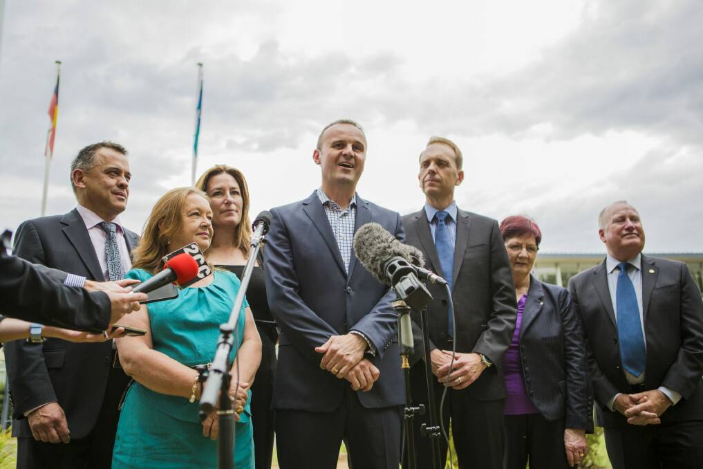In power: ACT chief minister Andrew Barr, centre, with his party’s  MLAs,  from left, Chris Bourke, Joy Burch, Yvette Berry,  deputy leader Simon Corbell, Mary Porter, and Mick Gentleman.  Photo: Jamila Toderas