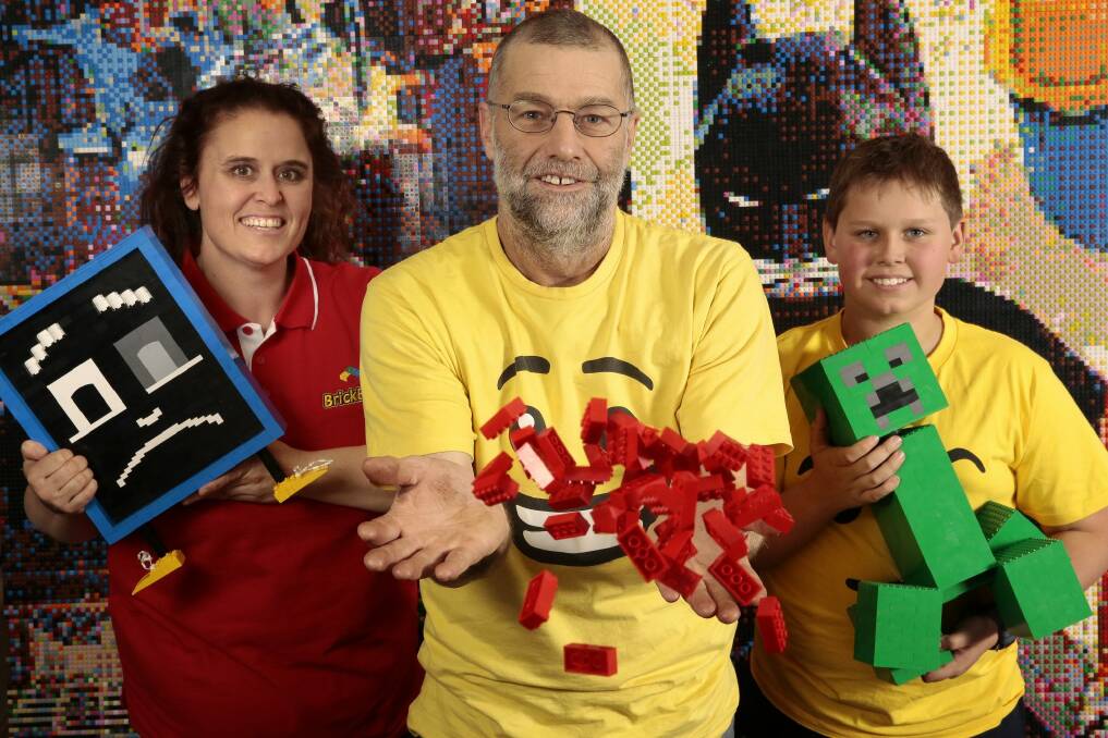 Mel Bezear, Anthony McLauchlan and Oliver McLauchlan, 11, of Wanniassa get ready for Canberra Brick Expo at the Hellenic Club in Woden this weekend. Photo: Jeffrey Chan