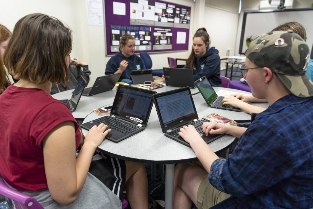Alfred Deakin High School students Jessica Booth (left) Catriona Cochrane, Catherine Smith and Sabrina Allan using Chromebooks at school Photo: Lawrence Aktin