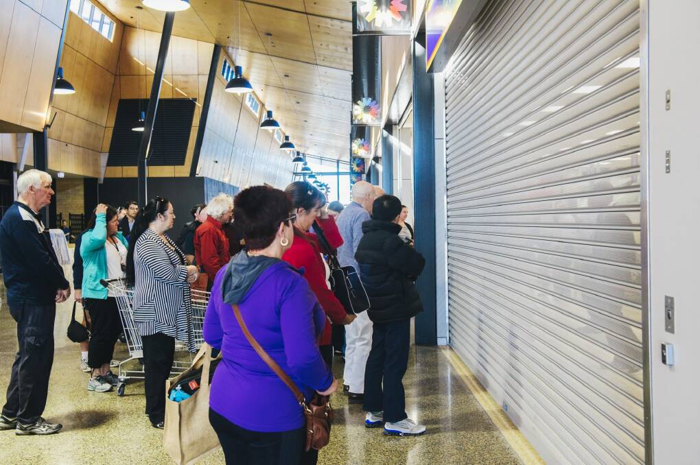 Shoppers wait for the doors to open on the new Aldi store in Casey on Wednesday morning. Photo: Rohan Thomson