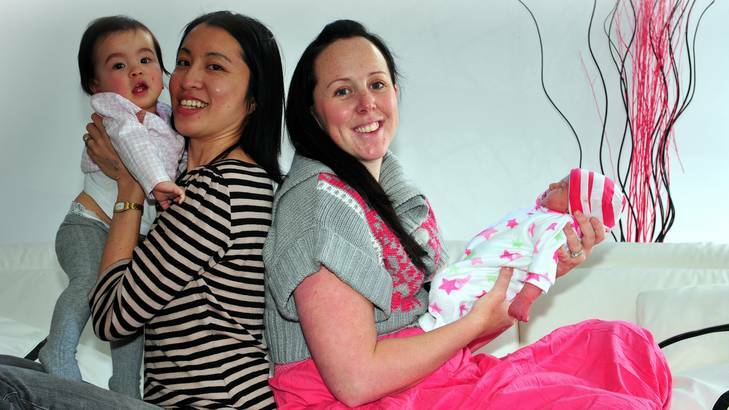 Two Canberra babies born in their family car at the same intersection... Sarah Yap (left) of Harrison with her daughter Audrey born August 12, 2011 and Erin Hayes of Franklin with daughter Chelsea, born on Thursday morning. Photo: Karleen Minney
