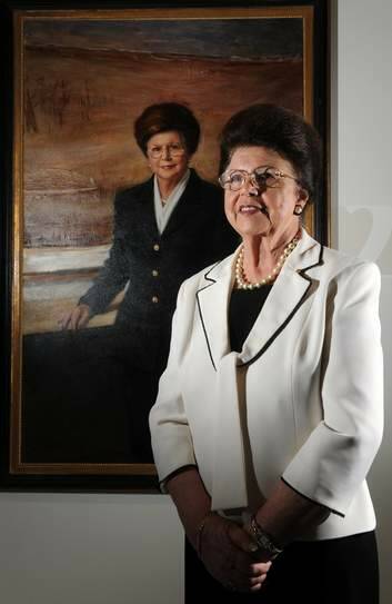 Imelda Roche stands in front of her portrait by Paul Newton. Photo: Graham Tidy
