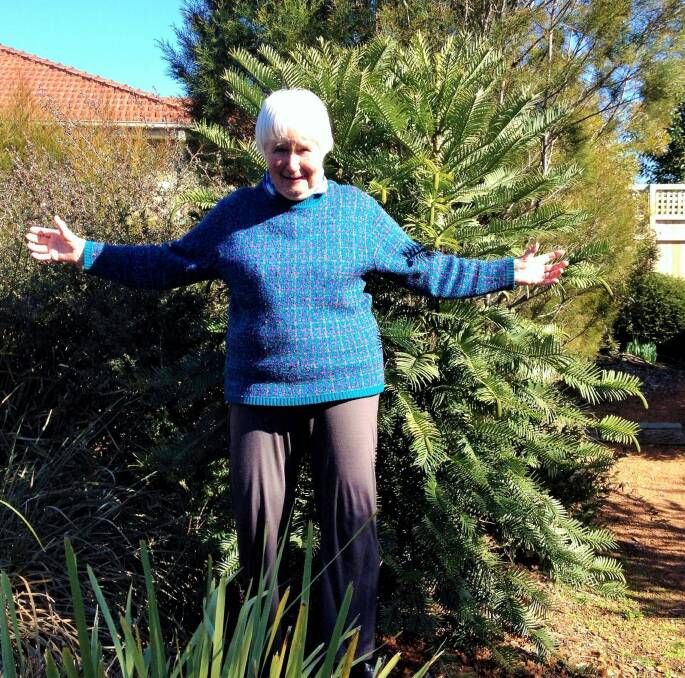 Elizabeth Compston lays claim to growing Canberra's widest wollemi pine.