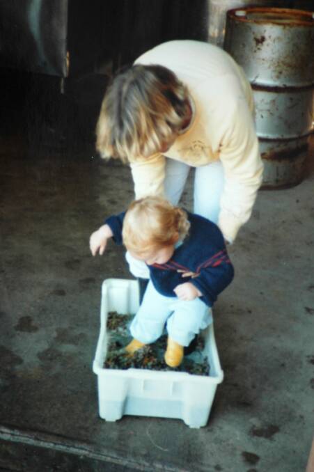Chris Carpenter from Lark Hill Winery at age 2, foot-stomping riesling with mum Sue Carpenter. Photo: Supplied