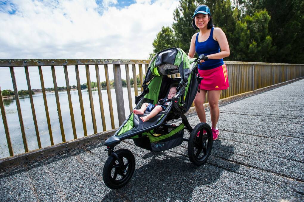 Alicia Teng of Gungahlin plans to oush through the 5km event at the Australian Running Festival with her 7-month-old Daniel. Photo: Elesa Kurtz