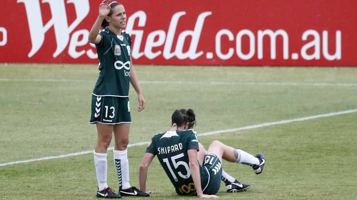 Canberra United player Nicole Sykes calls for a stoppage after teammate Sally Shipard was injured. Shipard will miss the rest of the season. Photo: Jeffrey Chan