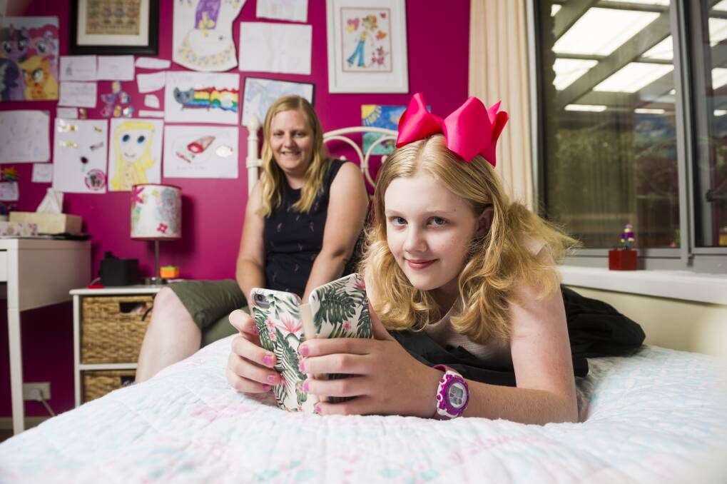Sharon Kley with her daughter Kristanna Kley 11, who uses her mobile phone to check her insulin levels at school for her type 1 diabetes.  Photo: Dion Georgopoulos