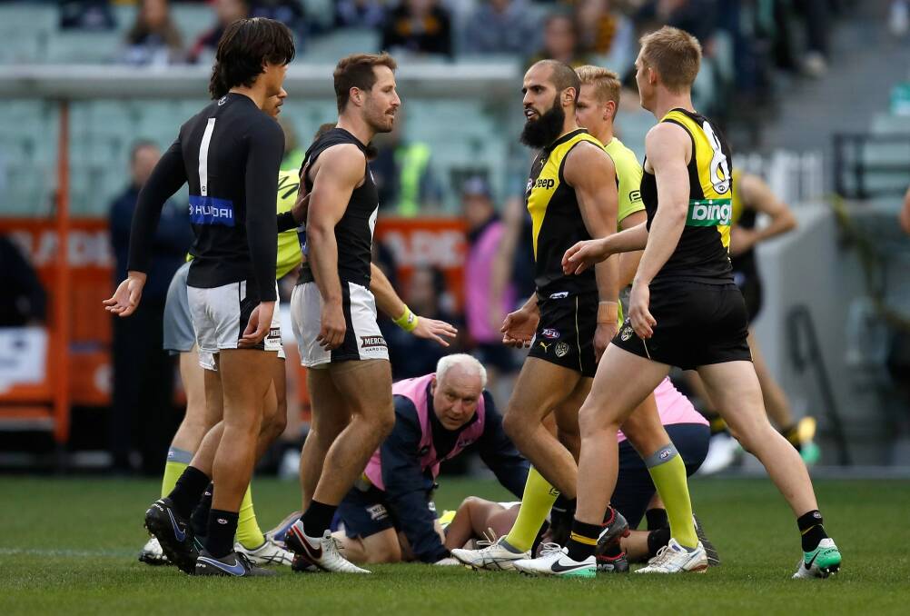 Jed Lamb on the ground after being struck by Bachar Houli. Photo: Getty Images