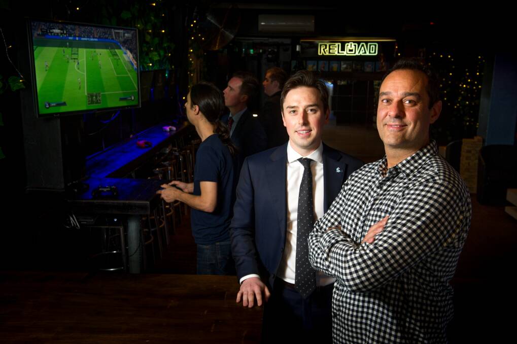 MLA Michael Pettersson wants to capture a corner of the booming Asian tourism market in video gaming as a spectator sport. Pictured with Reload co-owner Ravi Sharma. Photo: Elesa Kurtz