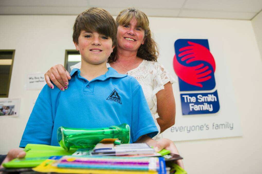 Archie, 11, who is entering year 6 this year with his mum Kylie Reid. The family have been helped by the Smith Family. Photo: Jamila Toderas